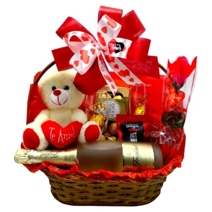 Cesta romântica de vime com espumante, taças, urso de pelúcia, rosa e chocolates